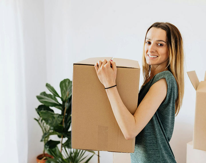 girl-carrying-box